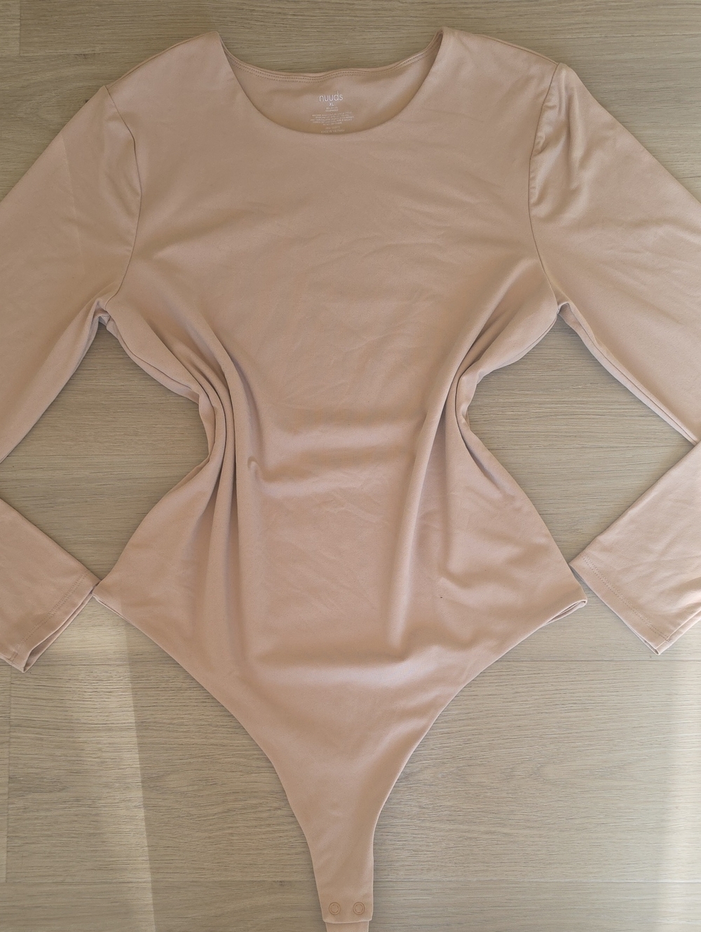 nuuds Long Sleeve Scoop Neck Bodysuit in cream.